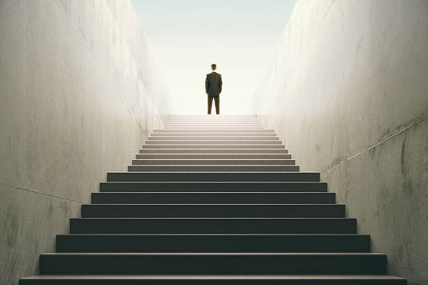 istock Man on top of the stairs 512212560