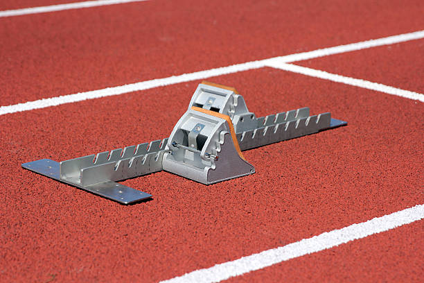 istock Athletics starting blocks on race track 512215249