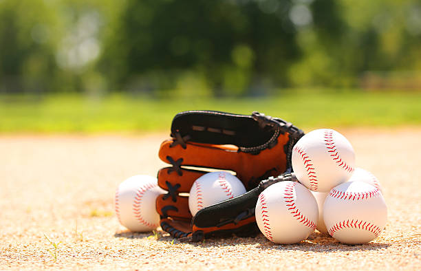 istock Baseball. Balls and Glove on Field 512215399