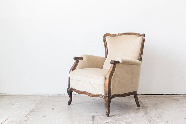 istock vintage armchair on white wall. 512215548