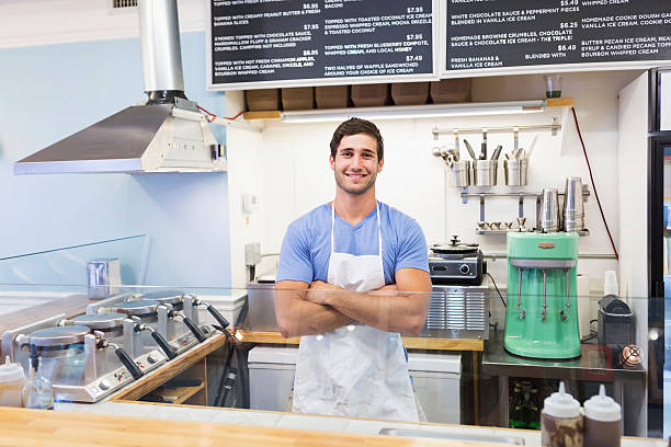 istock Man working in waffle shop 512216181