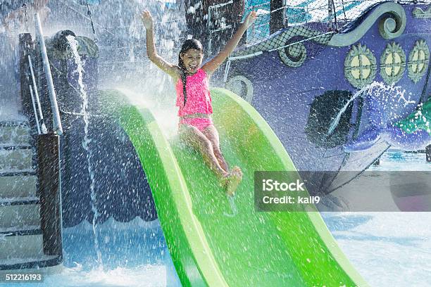 Girl On Water Slide Stock Photo - Download Image Now - Slide - Play Equipment, Sliding, Water Park