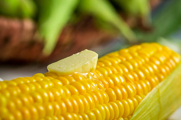Closeup of boiled corn served with butter