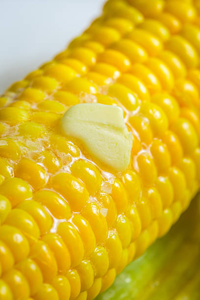 istock Closeup of fresh hot corn with butter 512217367