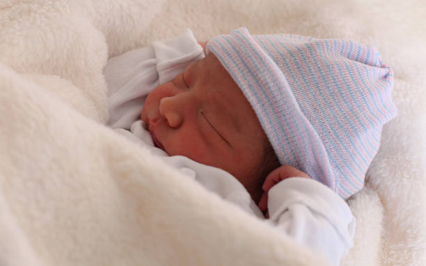 istock Newborn baby boy naps. 512217637