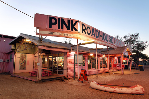 Oodnadatta, South Australia - October 1, 2013: The world famous landmark the Pink Roadhouse - Oodnadatta track, South Australia at sunset.
