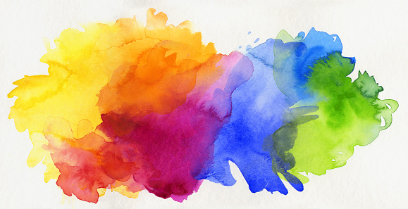 bright rainbow colored watercolor paints isolated on white paper