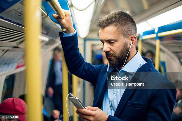 Serious Businessman Travelling To Work Standing Inside Undergro Stock Photo - Download Image Now