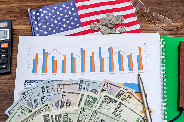 istock Business and profits concept with chart, usa dollar, coins, notebook 512219790