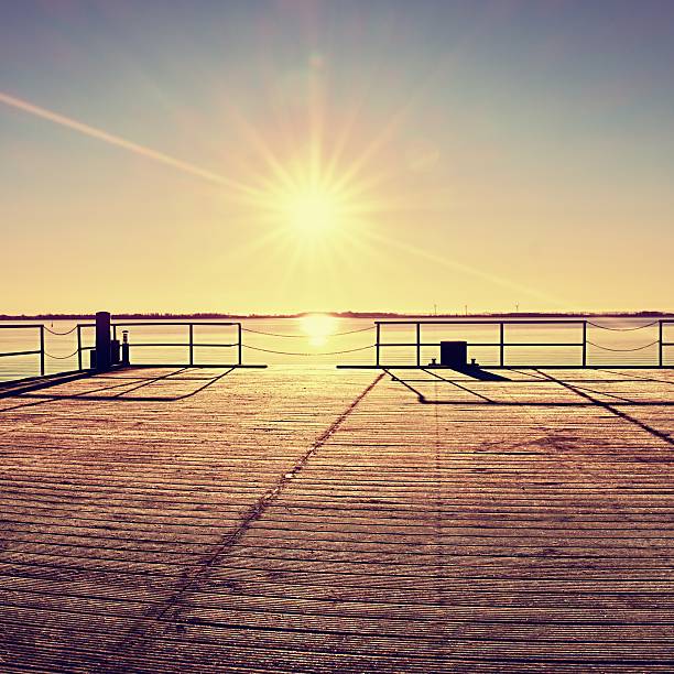 istock Empty wooden pier at beautiful colorful morning. 512220236