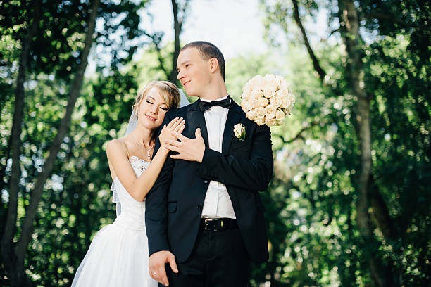 istock Bride and groom outdoors on a wedding day in park 512222366