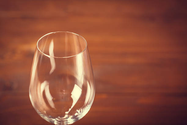 istock Empty Wine Glass Against Wooden Background 512223960