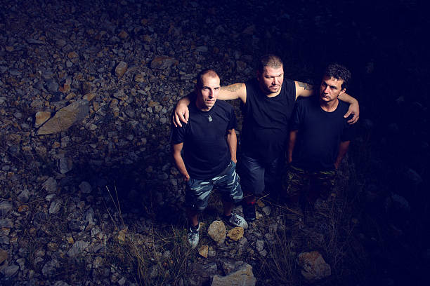 istock rock band posing outdoors 512224734