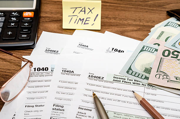 istock Time for taxes with money 512225468