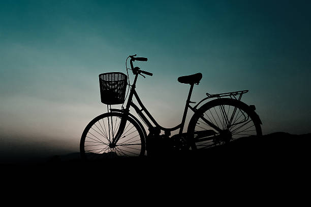 istock Silhouette of bicycle with sunset 512225888