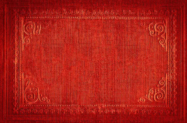 Photo of Bright red vintage background with embroidered ornamental frame, grunge texture