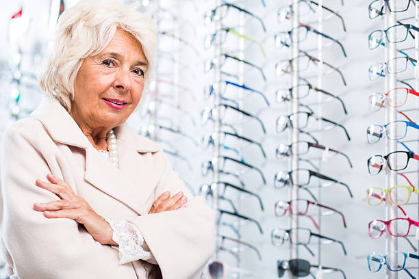 istock Elder woman in optician store 512228456