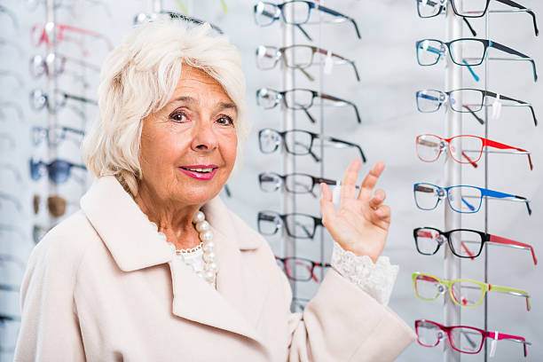 istock Senior woman in optician store 512228524