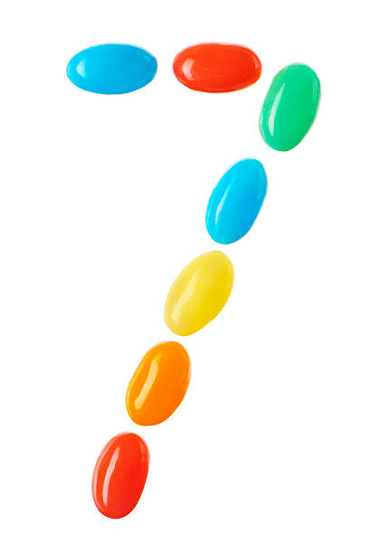 istock 7 number made of multicolored candies isolated on white 512229150