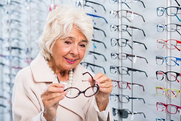istock Female trying on glasses 512229246