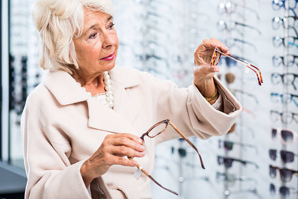 istock Female opticians patient buying glasses 512229392
