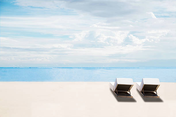 istock The beach, clear sand with deck chairs, idyllic travel background 512231282