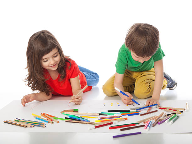 istock Boy and girl doodling 512231518