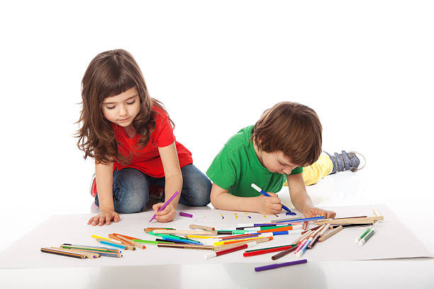 istock Boy and girl doodling 512231686
