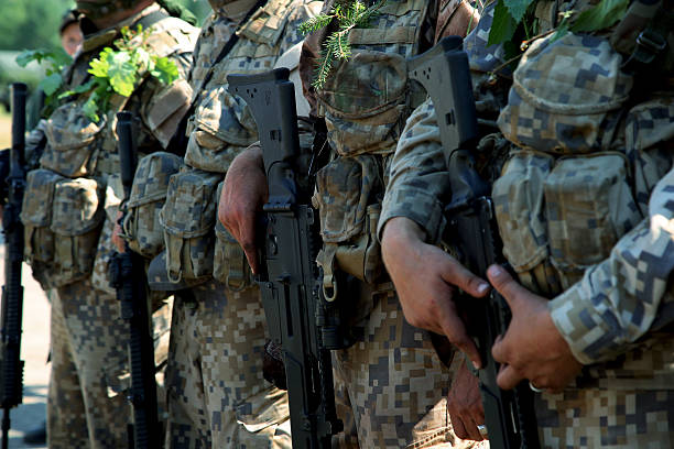 istock The soldiers with weapon 512252589