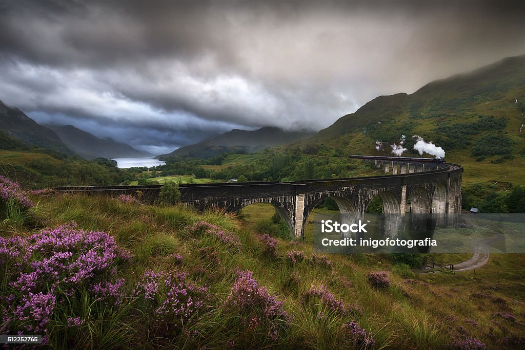 Glenfinnan Viaduct, Scotland Glefinnan viaduct, Scottish Highlands, United Kingdom, in a stormy day Cultures Stock Photo