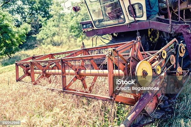 Closeup Of Harvesting Combine In Grain And Wheat Crops Stock Photo - Download Image Now