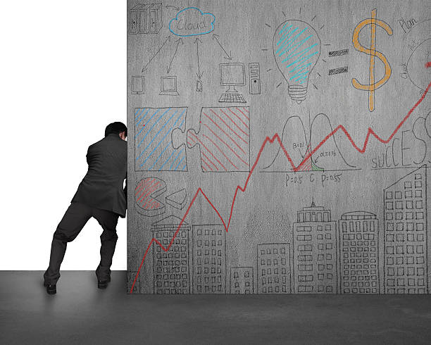 istock businessman pushing doodles concrete wall away 512254153