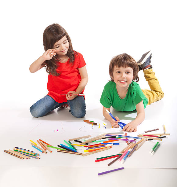 istock Boy and girl doodling 512272788