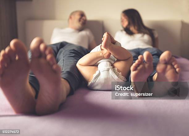 Happy Family Stock Photo - Download Image Now - Baby - Human Age, Diaper, Bed - Furniture
