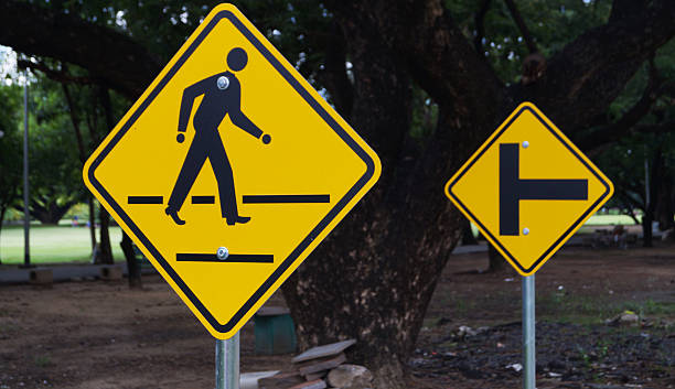 istock man walking sign on yellow sing background on road 512275106