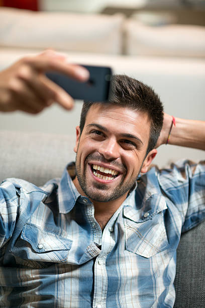 istock Young man taking selfie with phone 512275789