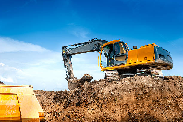 istock construction site digger, excavator and dumper truck. industrial 512276121