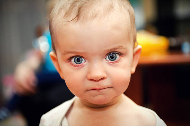 istock Little girl with big blue eyes 512276625