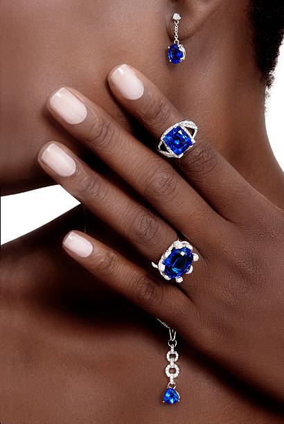 Tanzanite and Diamonds Designer Jewellery Tanzanite and Diamonds Designer Jewellery on the Skin of a Black Lady pendant photos stock pictures, royalty-free photos & images
