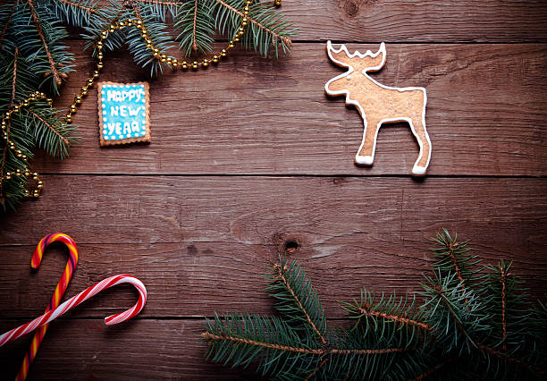 istock Gingerbread homemade cookies with icing and christmas tree branc 512278250