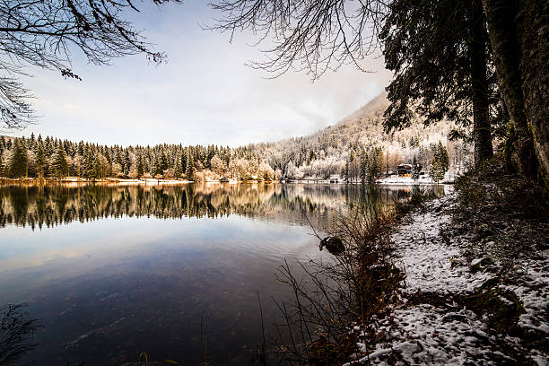 istock first snow at the mountain lake 512278378