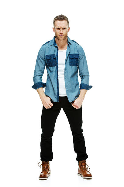 istock Fashionable hipster standing & looking at camera 512278475
