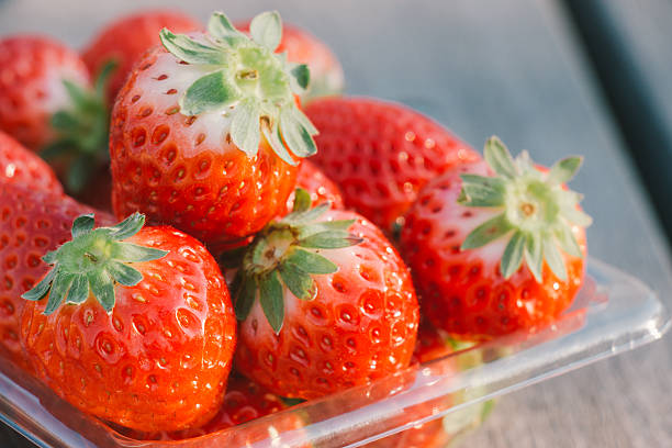 istock pile of Red strawberry on wooden table 512278836