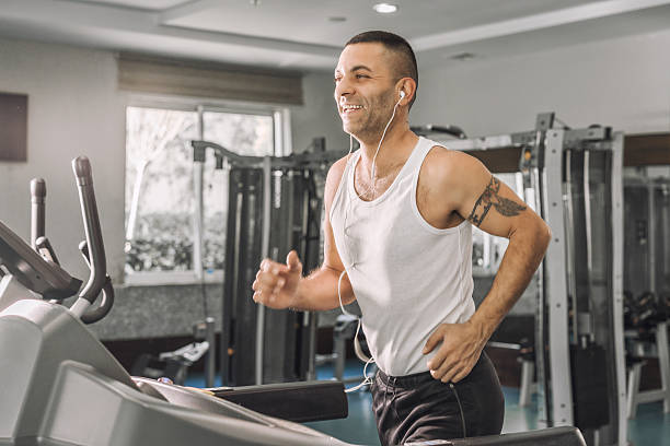 istock Man enjoying his run on treadmill 512279050