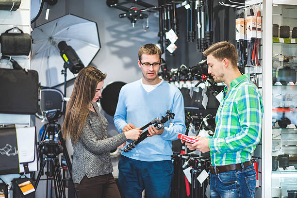 istock People buying photographic equipment 512279248