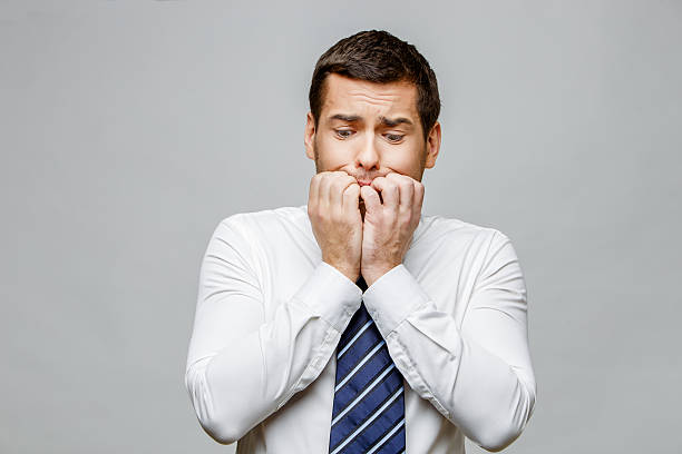 istock Handsome stylish businessman on grey background 512280886