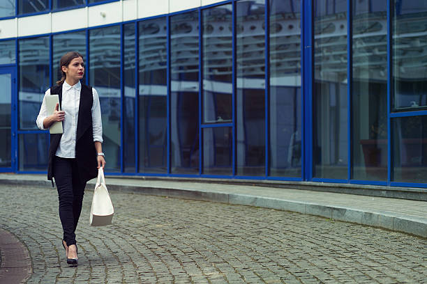 istock Business woman with a laptop 512280900