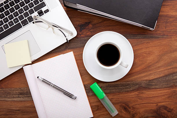 istock wooden table work place with laptop and cup of coffee 512280918