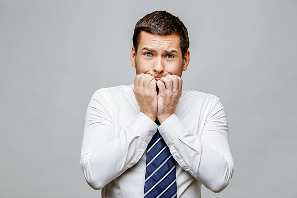 istock Handsome stylish businessman on grey background 512280942