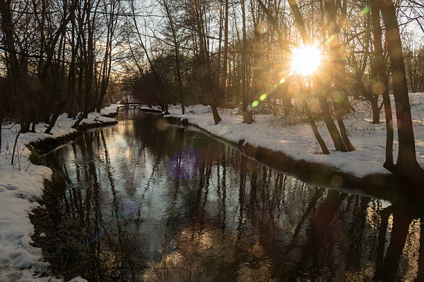 istock winter river, the sun and snow 512283328